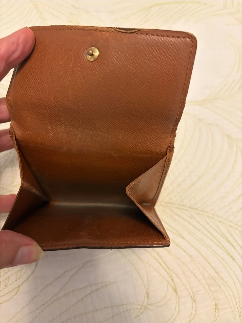 Louis Vuitton trifold snap wallet. Authentication provided.